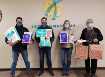 Lakeville employees with donated gifts